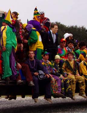 a group of Cajuns watching the Mardi Gra parade